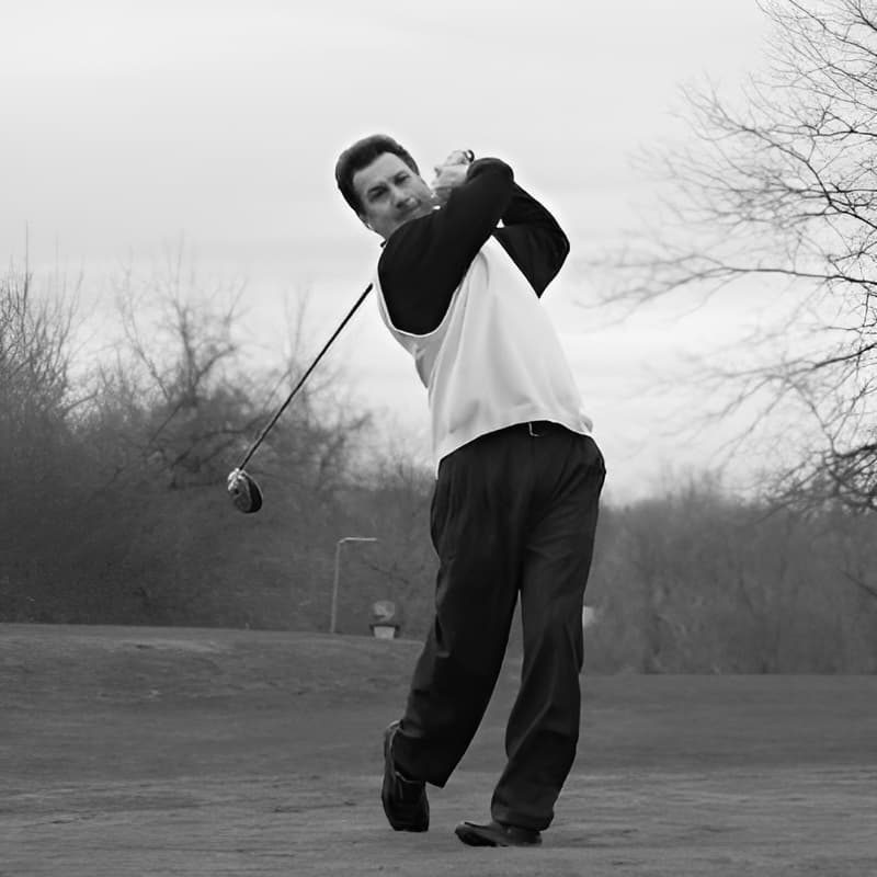 Ben Mutz finishing a golf swing.